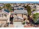 Charming two-story home featuring a two-car garage and desert landscaping in a well-maintained neighborhood at 6120 Crystal Cascade St, Las Vegas, NV 89130