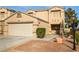 Charming two-story home featuring an attached two-car garage and well maintained landscaping at 6120 Crystal Cascade St, Las Vegas, NV 89130