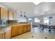Bright kitchen boasts updated countertops and tile backsplash, flowing into dining area with slider door at 6120 Crystal Cascade St, Las Vegas, NV 89130