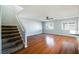 Second-floor room featuring staircase access, hardwood flooring, and ample sunlight at 6120 Crystal Cascade St, Las Vegas, NV 89130