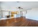 Spacious living area shows hardwood flooring, eat-in kitchen, and modern ceiling fans at 6120 Crystal Cascade St, Las Vegas, NV 89130