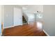 Spacious living room boasts gleaming hardwood floors, ample natural light, and staircase access at 6120 Crystal Cascade St, Las Vegas, NV 89130
