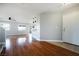 Open living space featuring hardwood flooring, neutral walls, and direct access to the kitchen at 6120 Crystal Cascade St, Las Vegas, NV 89130