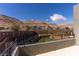 Backyard view showing the surrounding neighborhood and desert mountains in the distance at 6197 Jewel Vista St, Las Vegas, NV 89135