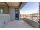 Outdoor balcony with metal railings showcasing neighborhood street view and residential buildings at 6197 Jewel Vista St, Las Vegas, NV 89135