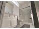 Bright bathroom featuring white cabinetry, a glass shower, and modern fixtures at 6197 Jewel Vista St, Las Vegas, NV 89135