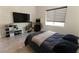 Bedroom with a modern style and decorative golf arcade game and ample closet space at 6197 Jewel Vista St, Las Vegas, NV 89135