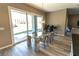 Bright dining area features modern lighting and a glass slider to the backyard at 6197 Jewel Vista St, Las Vegas, NV 89135