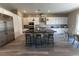 Modern kitchen with stainless steel appliances, a sleek center island, and white cabinets, creating a stylish space at 6197 Jewel Vista St, Las Vegas, NV 89135
