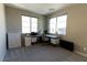 Bright home office with two windows and modern desk with storage for working from home at 6197 Jewel Vista St, Las Vegas, NV 89135