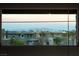 Magnificent view of the Las Vegas cityscape from the balcony, framed by contemporary homes and palm trees at 6197 Jewel Vista St, Las Vegas, NV 89135