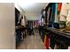 Spacious walk-in closet with double hanging rods and ample storage space for clothes and accessories at 6197 Jewel Vista St, Las Vegas, NV 89135