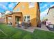 Beautiful backyard featuring well-maintained artificial turf, a covered patio, and comfortable seating areas for outdoor enjoyment at 632 Loyalty Ct, Henderson, NV 89011