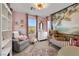 Charming Bedroom featuring pink walls, a crib, an area rug, and a mural at 632 Loyalty Ct, Henderson, NV 89011