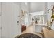 Bright entryway with hardwood floors, staircase, and views into the living room and dining area at 632 Loyalty Ct, Henderson, NV 89011