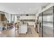 Bright, open kitchen with a large island, stainless steel appliances, and a dining area at 632 Loyalty Ct, Henderson, NV 89011