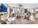 Open-concept living room with abundant natural light, hardwood floors, and stylish furnishings at 632 Loyalty Ct, Henderson, NV 89011