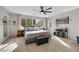 Spacious bedroom with ample natural light, ceiling fan, neutral carpet and modern furnishings at 632 Loyalty Ct, Henderson, NV 89011