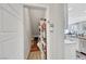 Walk-in pantry with custom shelving provides generous storage next to a modern white kitchen at 632 Loyalty Ct, Henderson, NV 89011