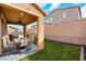 Inviting covered patio features stylish furniture, a ceiling fan, and a charming blue rug, perfect for outdoor gatherings at 632 Loyalty Ct, Henderson, NV 89011