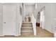 Elegant staircase leading to the upper level, accentuated by natural light and stylish decor at 632 Loyalty Ct, Henderson, NV 89011