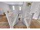 Bright stairway features white banisters, natural light from transom windows and neutral carpeted stairs at 632 Loyalty Ct, Henderson, NV 89011