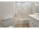 Bright bathroom with a shower-tub combo featuring sliding glass doors and a single vanity at 6479 Gunderson Blvd, Las Vegas, NV 89103