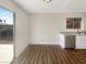 Dining area with backyard access, stainless steel dishwasher, and hardwood floors at 6479 Gunderson Blvd, Las Vegas, NV 89103