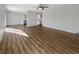 Bright living room with hardwood floors and ceiling fan at 6479 Gunderson Blvd, Las Vegas, NV 89103