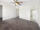 Main bedroom with carpet, ceiling fan, and en suite bathroom at 6479 Gunderson Blvd, Las Vegas, NV 89103