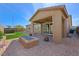 Stunning backyard with covered patio, fire pit, hot tub, and low-maintenance landscaping at 6602 Windy Palm St, North Las Vegas, NV 89086