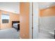 This bathroom features a shower-tub combination and bright lighting at 6602 Windy Palm St, North Las Vegas, NV 89086