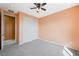 This cozy bedroom features neutral carpet, modern ceiling fan and spacious closet at 6602 Windy Palm St, North Las Vegas, NV 89086