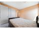 This bedroom features neutral carpet and a large closet at 6602 Windy Palm St, North Las Vegas, NV 89086
