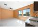 This bonus room features a kitchenette and large windows at 6602 Windy Palm St, North Las Vegas, NV 89086