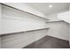 Spacious walk-in closet with shelving and gray carpet at 6602 Windy Palm St, North Las Vegas, NV 89086