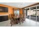Spacious dining area with sliding glass doors and outdoor views, great for Gathering gatherings at 6602 Windy Palm St, North Las Vegas, NV 89086