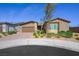 Beautiful single-story home with a tandem three-car garage and a low maintenance desert landscape at 6602 Windy Palm St, North Las Vegas, NV 89086