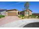Beautiful single-story home with a tandem three-car garage and a low maintenance desert landscape at 6602 Windy Palm St, North Las Vegas, NV 89086