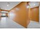 Hallway with tile flooring that leads into a living room at 6602 Windy Palm St, North Las Vegas, NV 89086