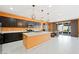 This spacious kitchen features an island, stainless steel appliances, and stylish pendant lighting at 6602 Windy Palm St, North Las Vegas, NV 89086