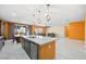 Open concept kitchen with large island, stainless steel appliances, and plenty of counter space at 6602 Windy Palm St, North Las Vegas, NV 89086