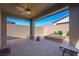 Covered patio boasts ample seating and an outdoor ceiling fan at 6602 Windy Palm St, North Las Vegas, NV 89086