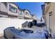 Spacious backyard featuring a covered patio area, white fencing and desert landscaping at 7350 N Decatur Blvd # 5, Las Vegas, NV 89131