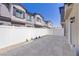 Private backyard featuring a paved patio, white fence, and low-maintenance landscaping at 7350 N Decatur Blvd # 5, Las Vegas, NV 89131