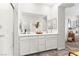 A luxurious bathroom offers a double vanity, glass shower, and neutral tones at 7350 N Decatur Blvd # 5, Las Vegas, NV 89131
