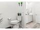 Bright bathroom featuring a modern toilet and neutral decor at 7350 N Decatur Blvd # 5, Las Vegas, NV 89131