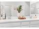 This bright bathroom has a double vanity with modern fixtures and decor at 7350 N Decatur Blvd # 5, Las Vegas, NV 89131
