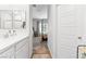 View from the bathroom through to the bedroom with a comfortable bed at 7350 N Decatur Blvd # 5, Las Vegas, NV 89131