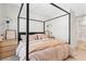 This bedroom features a four-poster bed, soft neutral tones, and stylish decor at 7350 N Decatur Blvd # 5, Las Vegas, NV 89131